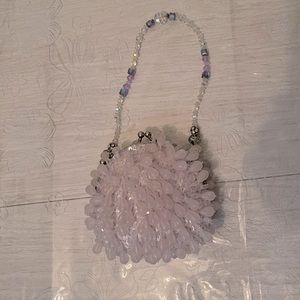 La Ragale purple beaded clutch